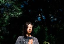 Mindful Moments: Beautiful Stories of Finding Peace and Clarity photo of woman doing yoga while sitting on rock