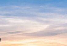 Nature’s Wonders: Stunning Visuals and Stories of the Natural World person climbing on mountain