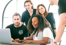 Navigating Office Politics: Strategies for Success in the Workplace woman sharing her presentation with her colleagues