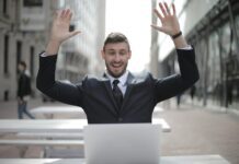 Overcoming Self-Doubt: Strategies for Building Confidence man in black suit raising both hands