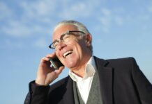 From Failure to Success: Lessons Learned on the Road to Achievement cheerful senior businessman talking on smartphone on street