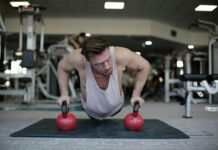 The Power of Setting Intentions: Aligning Your Actions with Your Goals strong sportsman during training with kettlebells in gym