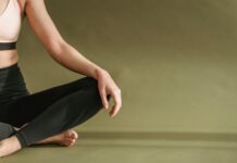 Self-Care Rituals: Nurturing Your Mind, Body, and Spirit young woman doing yoga in lotus pose