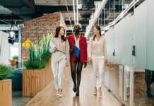 Mastering Body Language: Nonverbal Communication Tips for Success diverse elegant multiracial businesswomen walking in contemporary office