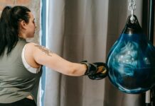 The Role of Gratitude in Cultivating Motivation woman punching boxing ball during training in gym