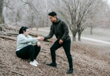 The Importance of Motivation an instructor supporting young woman while training in a park