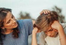 Cultivating Emotional Intelligence: Nurturing Relationships and Self-Awareness woman in blue shirt talking to a young man in white shirt
