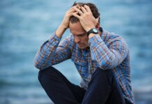 Stress Management Techniques: Mindfulness Strategies for Coping with Daily Pressures man in blue and brown plaid dress shirt touching his hair