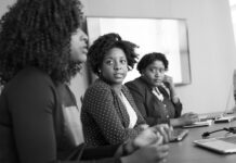 What Are Three Ways to Increase Productivity? woman discussing with her colleagues