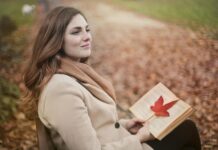 Success Story of a Poor Girl young woman with book in autumn park