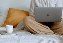Career Development Examples anonymous woman using laptop in bedroom