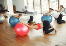 Expectancy Theory of Motivation pregnancy group practicing with fit ball in fitness class