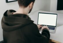 Examples of Productivity in the Workplace man in black long sleeve shirt using macbook pro