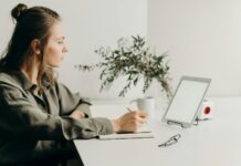 How to Increase Productivity in the Workplace woman in gray coat using white laptop computer