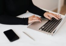 Career Development Plan crop faceless woman working on netbook in office