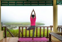 5 Ways to Practice Mindfulness unrecognizable woman doing vriksasana pose on terrace