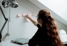 How to Become More Productive and Motivated a person taking notes