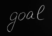 What are the 3 Types of Goal Setting? goal lettering text on black background