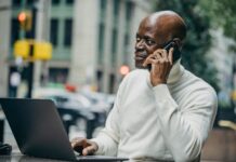 Benefits of Personality Tests in the Workplace black businessman talking on mobile phone