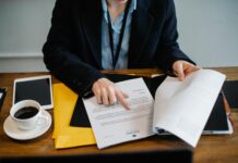 Ethical Issues of Personality Tests in the Workplace crop businesswoman working with documents in office