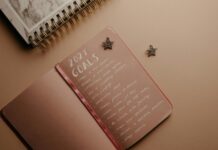 How do you Set Goals in Life? brown notebook on the table