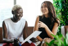 What Are the 5 SMART Goals? diverse cheerful colleagues talking about important documents