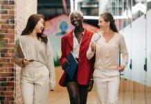 SMART Goals Examples for Business diverse successful businesswomen smiling and walking together in modern workplace