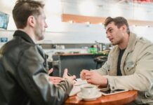 Career Development Programs for Students coworkers discussing project at table with coffee