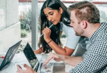 How to Apply Motivational Theories in the Workplace a man and woman planning their business together