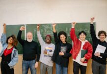 Poor Students Success Stories people raising their hands