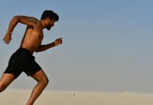 The Power of Motivation strong shirtless sportsman jogging on bright day