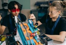 Productivity Tips for Students man in red protective goggles sitting beside woman in black shirt