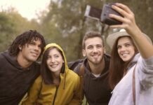 What Are the Three Types of Personal Growth? happy diverse friends taking selfie in park