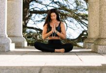 How Do I Practice Mindfulness? woman in black tank top and black pants sitting on concrete floor