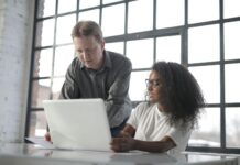 What are the Five Areas of Career Development? concentrated diverse coworkers of different age with laptop and documents during office work