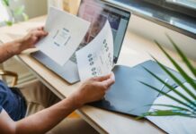What is the Best Definition of Career Development? crop man with documents and laptop at table