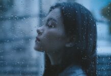 What Are the 7 Attitudes of Mindfulness? unhappy thoughtful teen girl arms crossed in rainy day