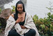 Mindful Living close up shot of a woman meditating