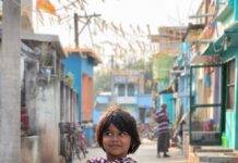 The Power of Belief: A Small-Town Girl Who Conquered the World young girl in colorful urban alleyway
