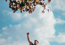 Unbreakable Spirit: Overcoming Adversity with Resilience man jumping from a rock